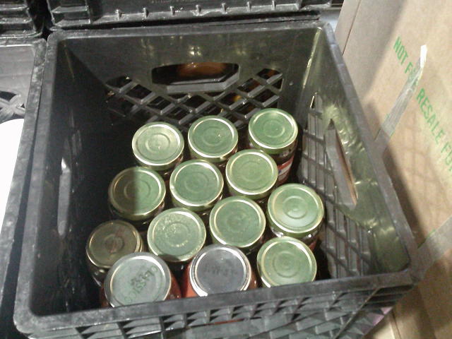 Thirteen jars in a crate.